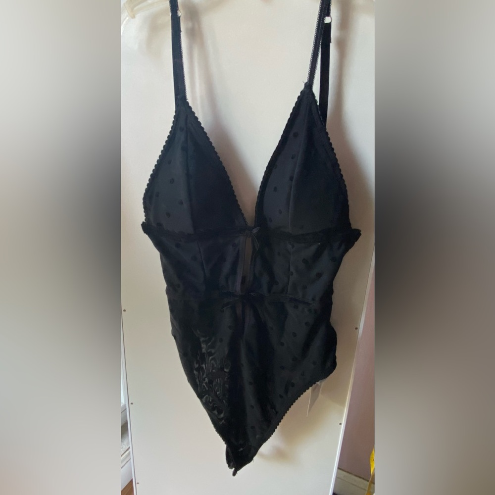 Black Forever 21 polkadot mesh bodysuit. Perfect for parties,clubbing etc.